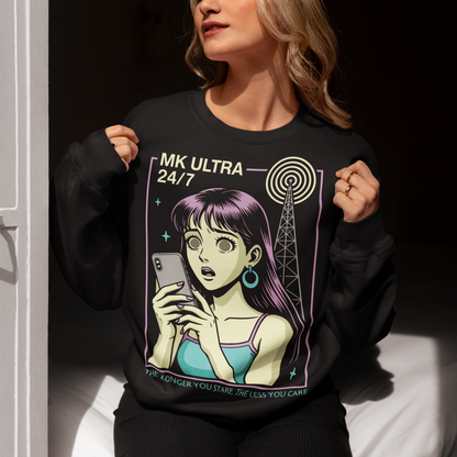 MK Ultra Sweatshirt - Conspiracy Theory Shirt - Mind Control Top - Funny Anime Gift. Step into a hypnotic, retro-futurist vibe with this MK Ultra–inspired sweatshirt, where vintage anime style meets eerie mind-control lore. The design features a wide-eyed character locked into her phone, spiral eyes hinting at digital trance, while a looming signal tower pulses overhead like a silent puppeteer. It’s equal parts nostalgic, unsettling, and irresistibly cool.