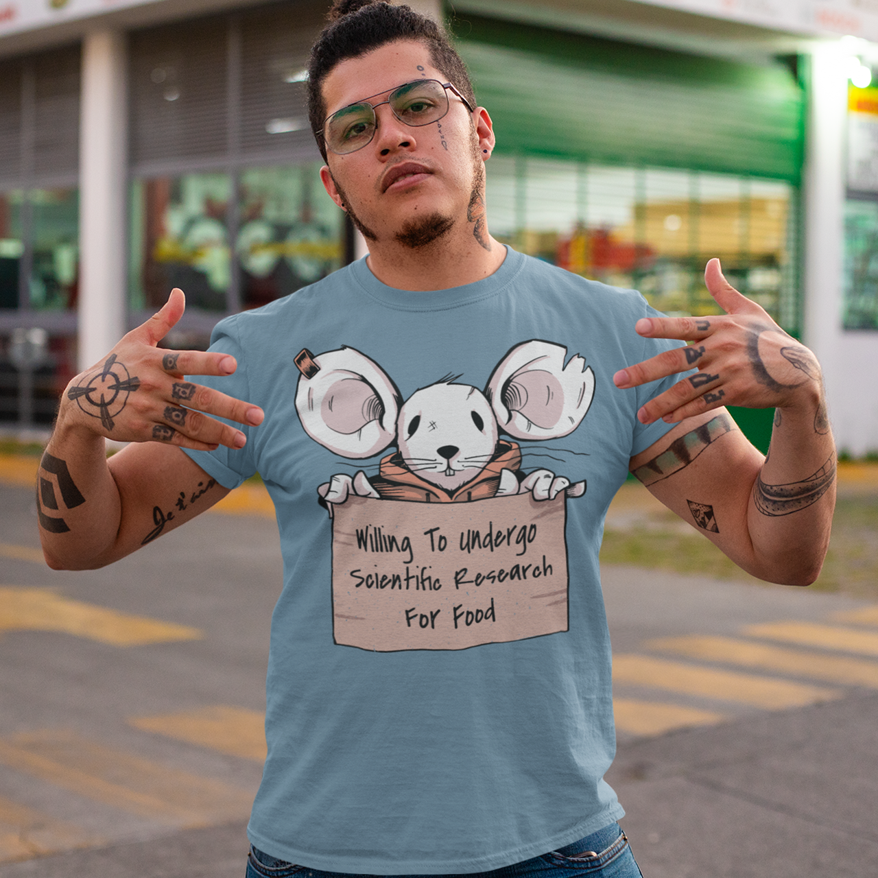 Steel blue t-shirt with mouse holding a sign. Sign reads "WILLING TO UNDERGO SCIENTIFIC RESEARCH FOR FOOD".