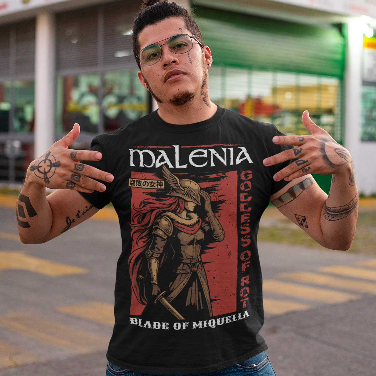 Show your strength and style with this bold Malenia, Goddess of Rot t-shirt. Featuring stunning artwork of the legendary warrior with her iconic red hair and golden armor, this design captures her fierce and elegant power. Perfect for gamers, fantasy lovers, and fans of epic boss battles, this shirt combines dark aesthetic tones with a vintage Japanese poster vibe. A must-have collectible tee for anyone who respects the Blade of Miquella.