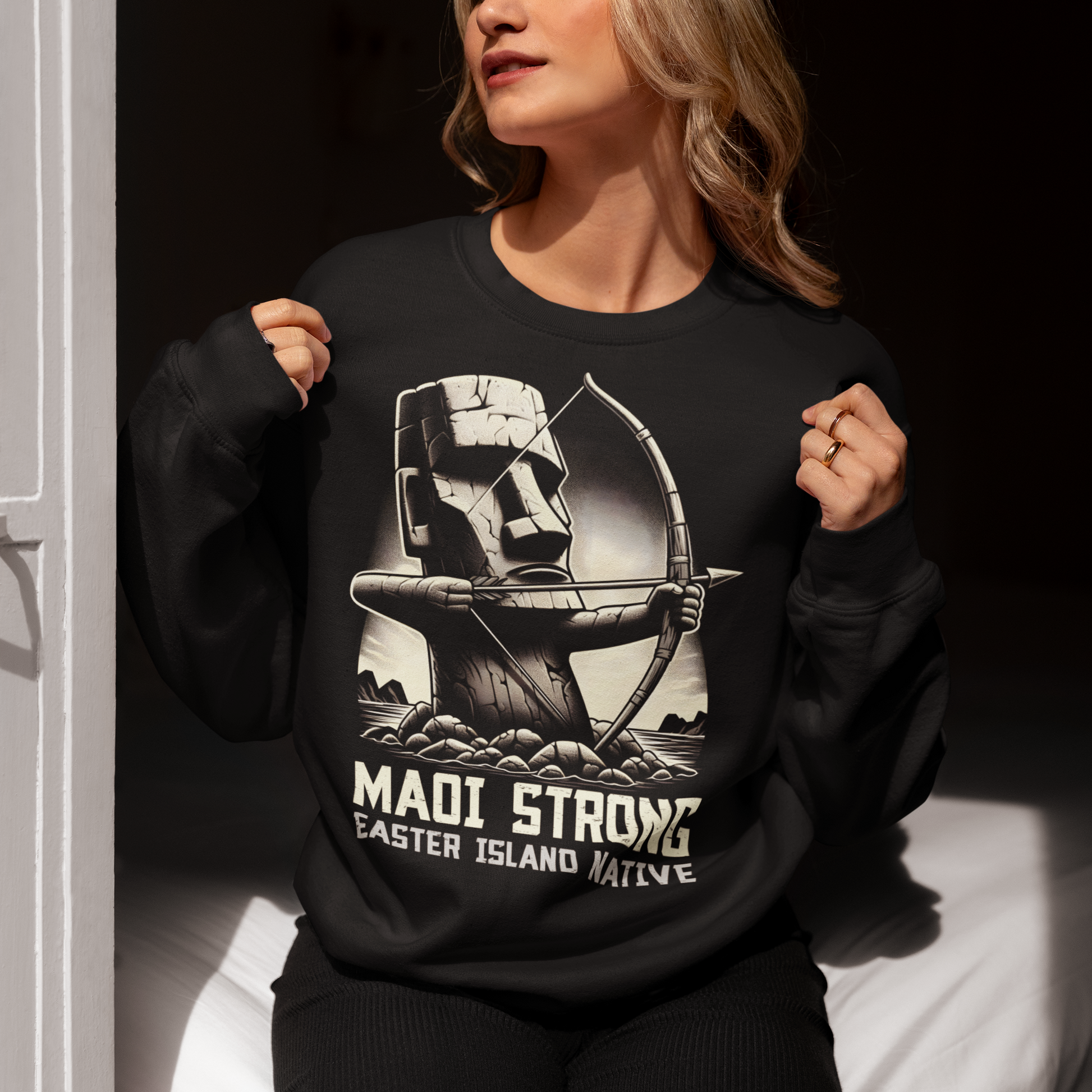 Black sweatshirt of a Maoi statue with a bow and arrow on Easter Island with text underneath "MAOI STRONG EASTER ISLAND NATIVE."