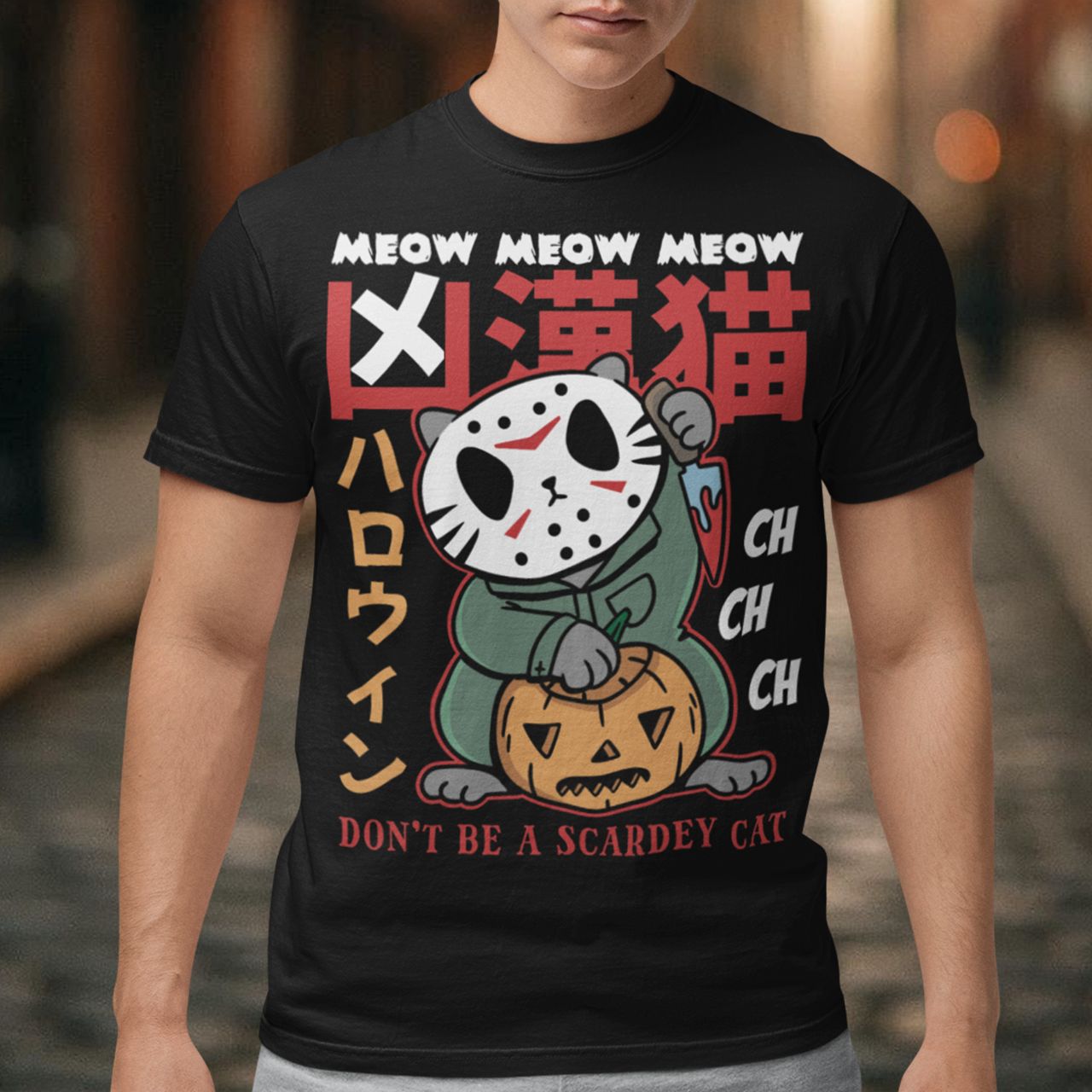 Unleash spooky-cute vibes with our Japanese Horror Cat T-Shirt! Featuring a chilling yet playful design, this shirt showcases a wide-eyed, horror cat inspired by Japanese art styles. Above the cat, bold text reads “MEOW MEOW MEOW CH CH CH”, while below it warns “DON’T BE A SCAREDY CAT”—perfect for Halloween lovers with a dark sense of humor. Made from soft, breathable cotton, this shirt is ideal for parties, trick-or-treating, or just showing off your love for horror and cats all year round.