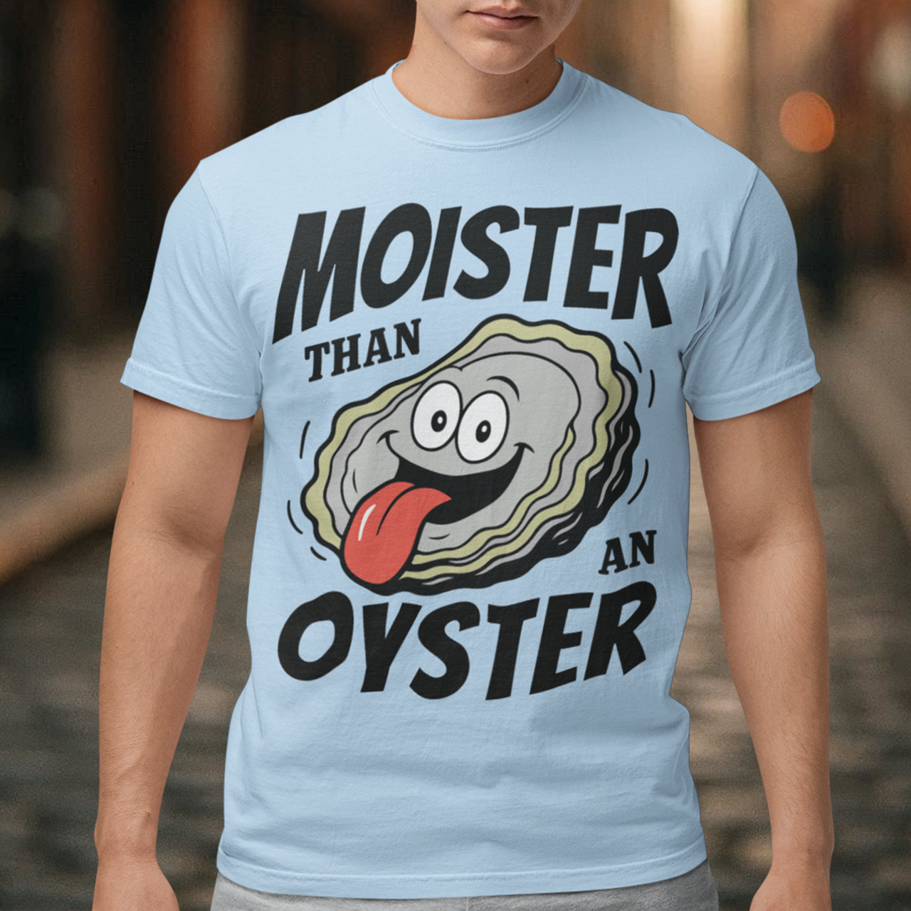 Moister Than An Oyster. This shirt serves up bold humor with a cheeky cartoon oyster grinning ear to ear, tongue out and living its best briny life. The oversized “Moister Than an Oyster” slogan makes zero attempt to be subtle, and that is exactly the point. It is loud, playful, and built for people who enjoy their jokes with a splash of chaos. Perfect for beach trips, bachelorette weekends, seafood lovers, or anyone whose sense of humor lives comfortably in the “did they really just wear that?”