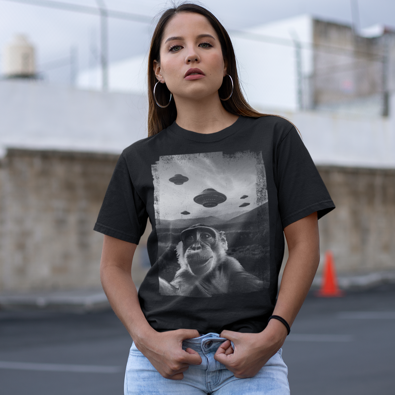 Black t-shirt of a monkey taking a selfie with UFOs in the background.