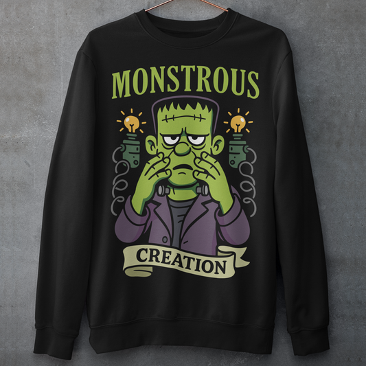 Monstrous creation sweatshirt - Frankenstein shirt. Bring a spark of classic horror to your wardrobe with this bold “Monstrous Creation” sweatshirt. Featuring a grumpy, stitched-up Frankenstein brought to life in a playful cartoon style, this design is a fun tribute to vintage horror with a modern, humorous twist. Surrounded by crackling energy and glowing lab elements, the character captures that iconic “it’s alive!” moment, but with a perfectly unimpressed expression that steals the show.