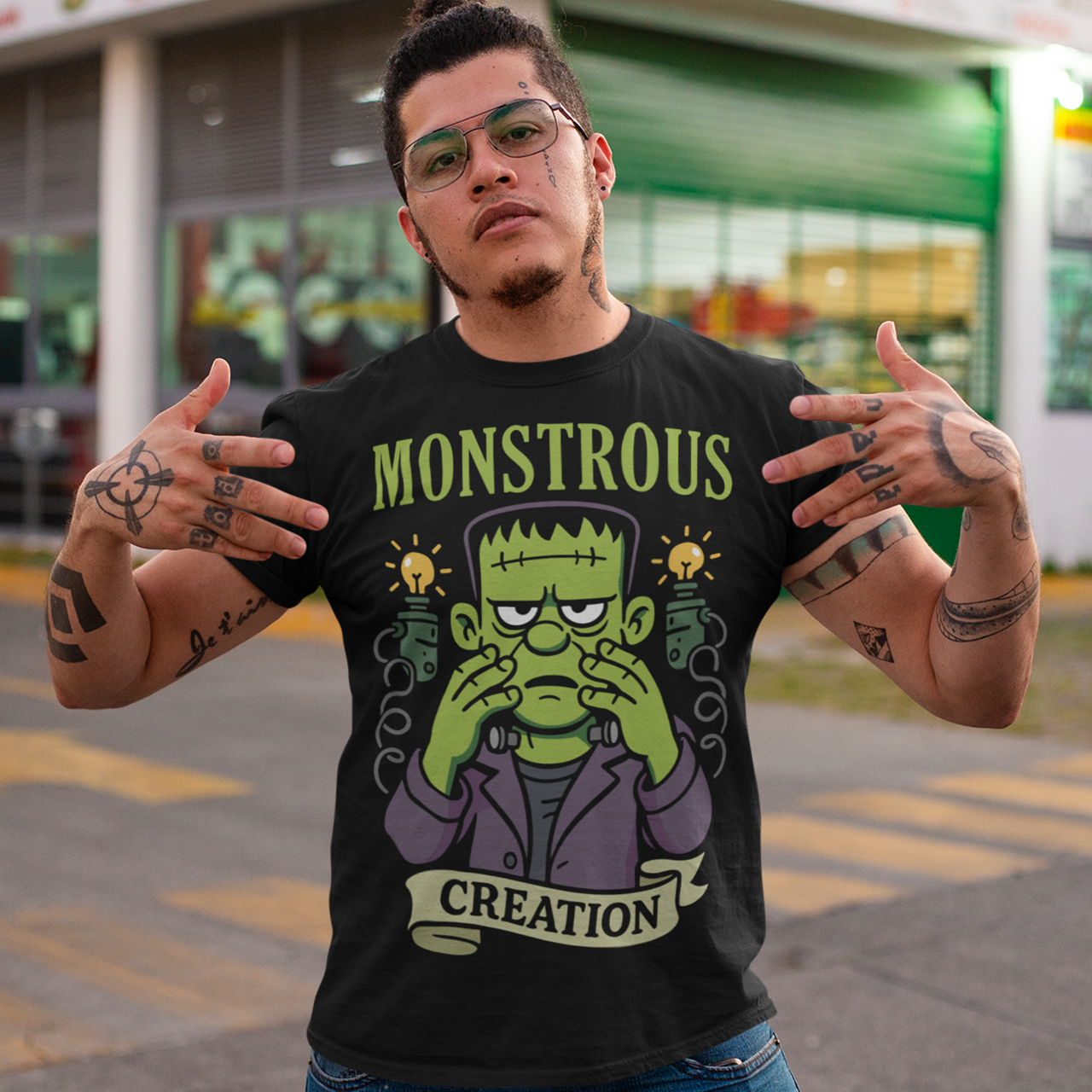Monstrous creation t-shirt - Frankenstein shirt. Bring a spark of classic horror to your wardrobe with this bold “Monstrous Creation” t-shirt. Featuring a grumpy, stitched-up Frankenstein brought to life in a playful cartoon style, this design is a fun tribute to vintage horror with a modern, humorous twist. Surrounded by crackling energy and glowing lab elements, the character captures that iconic “it’s alive!” moment, but with a perfectly unimpressed expression that steals the show.