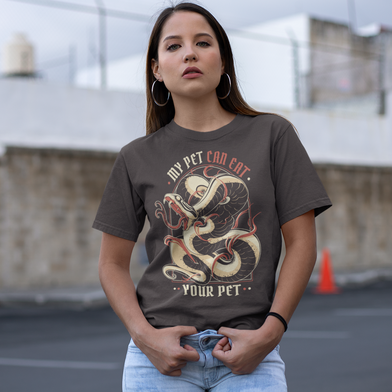 Brown t-shirt featuring a snake  with text  "MY PET CAN EAT YOUR PET".