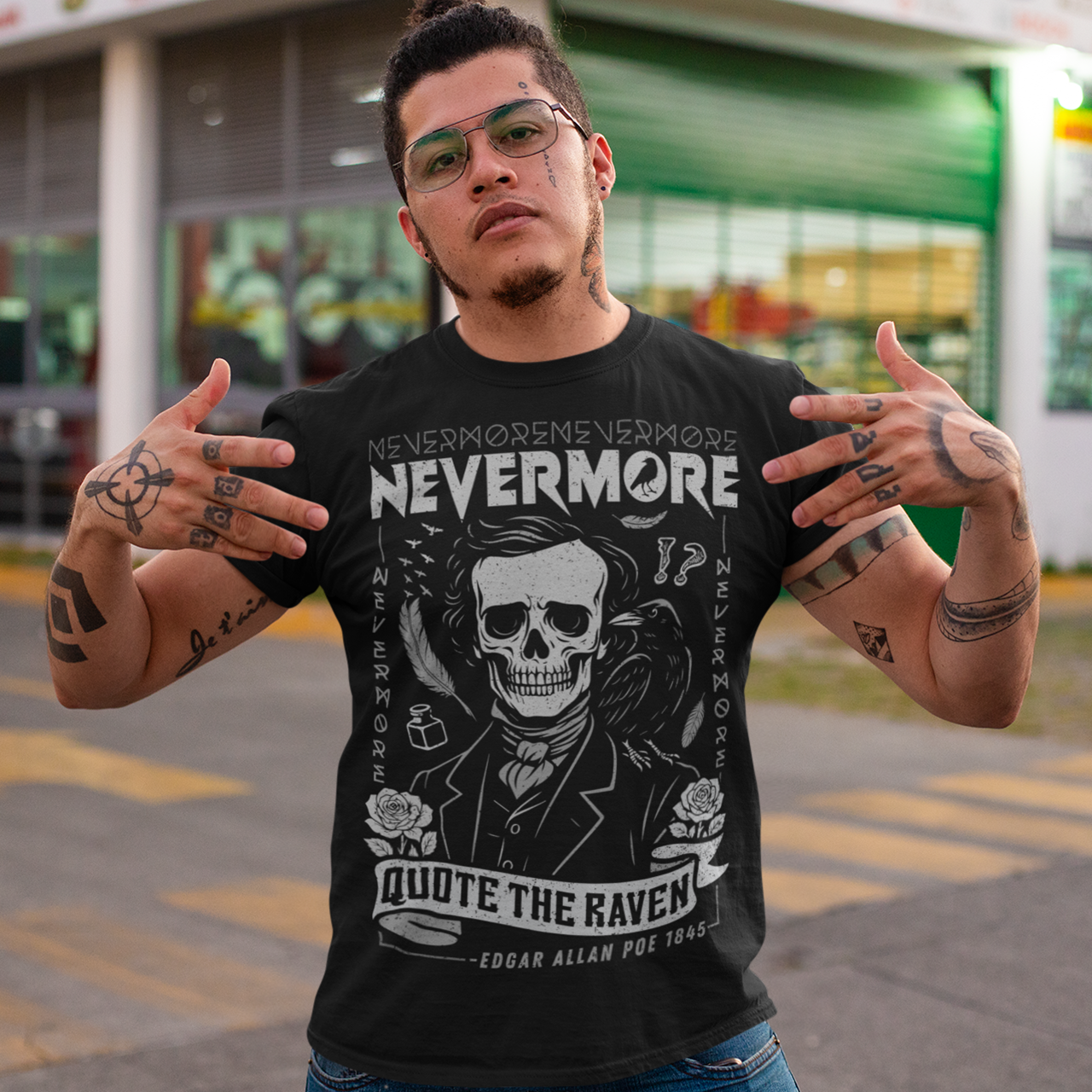 Quote The Raven Nevermore T-Shirt - Edgar Allen Poe Shirt. Step into the haunting world of classic literature with this striking “Nevermore” graphic t-shirt, inspired by the timeless work of Edgar Allan Poe. Featuring a skeletal portrait of the iconic poet alongside a watchful raven, this design captures the eerie essence of The Raven with bold gothic flair. Surrounded by dark symbolism like feathers, ink, and cryptic details, the artwork evokes a sense of mystery, melancholy, and poetic obsession.