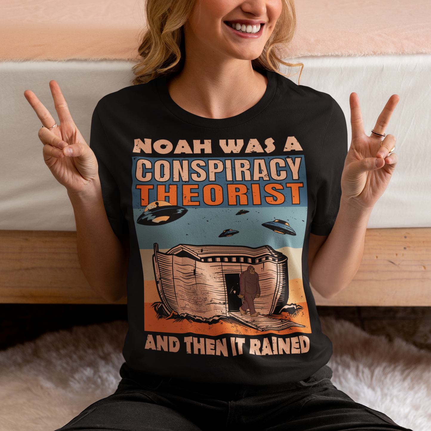 Introducing our unique and eye-catching Noah's Ark Conspiracy Theory T-Shirt! This extraordinary design combines elements of ancient folklore, modern conspiracy theories, and a touch of retro nostalgia, making it a conversation starter wherever you go. The central focus of the design features the legendary Noah's Ark, but with a twist. Outside the ark are the enigmatic figures of Bigfoot and hovering UFOs.