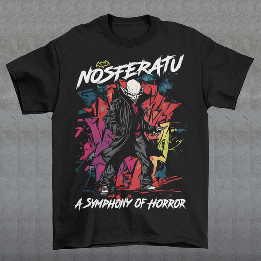 This bold graffiti-style Nosferatu T-Shirt fuses street art with classic horror. The design features a menacing, stylized depiction of Count Orlok with exaggerated, sharp features rendered in vibrant sprays and drips of color, mimicking the gritty texture of urban graffiti. Above the design, the text "NOSFERATU" stands out in bold, dripping block letters, while below, the phrase "A SYMPHONY OF HORROR" is written in an ominous, hand-scrawled font. 