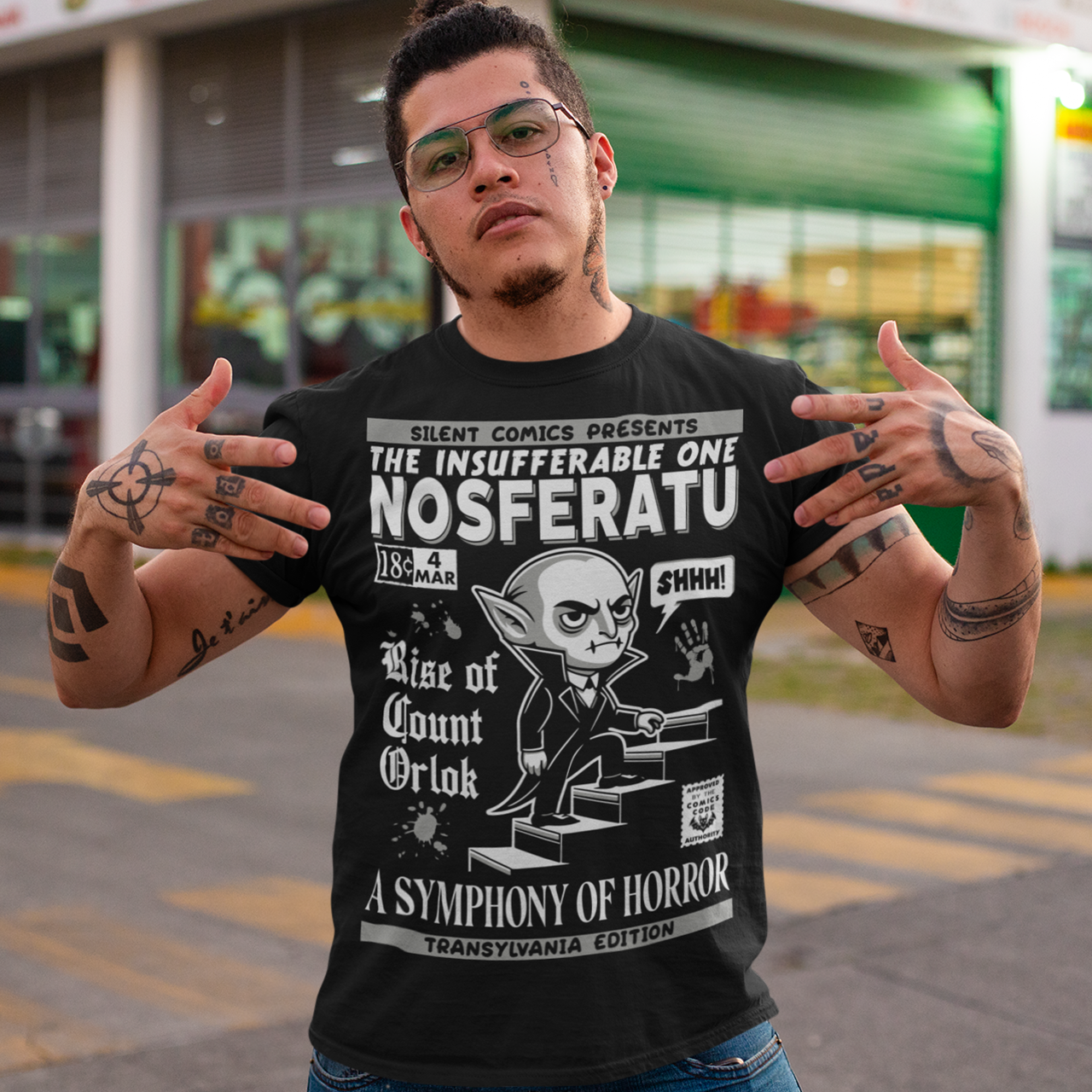 Unleash the eerie allure of classic horror with this Nosferatu comic book cover t-shirt! The design features a stunning vintage-style comic book rendition of the iconic vampire, Count Orlok, emerging from the shadows. Perfect for fans of classic horror, retro comics, and timeless gothic vibes, this t-shirt is a wearable piece of cinematic and artistic history.