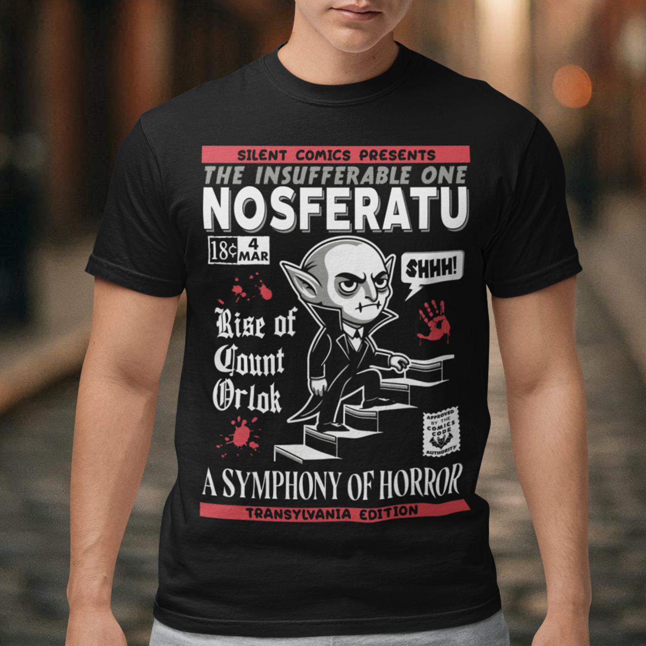 Unleash the eerie allure of classic horror with this Nosferatu comic book cover t-shirt! The design features a stunning vintage-style comic book rendition of the iconic vampire, Count Orlok, emerging from the shadows. Perfect for fans of classic horror, retro comics, and timeless gothic vibes, this t-shirt is a wearable piece of cinematic and artistic history.