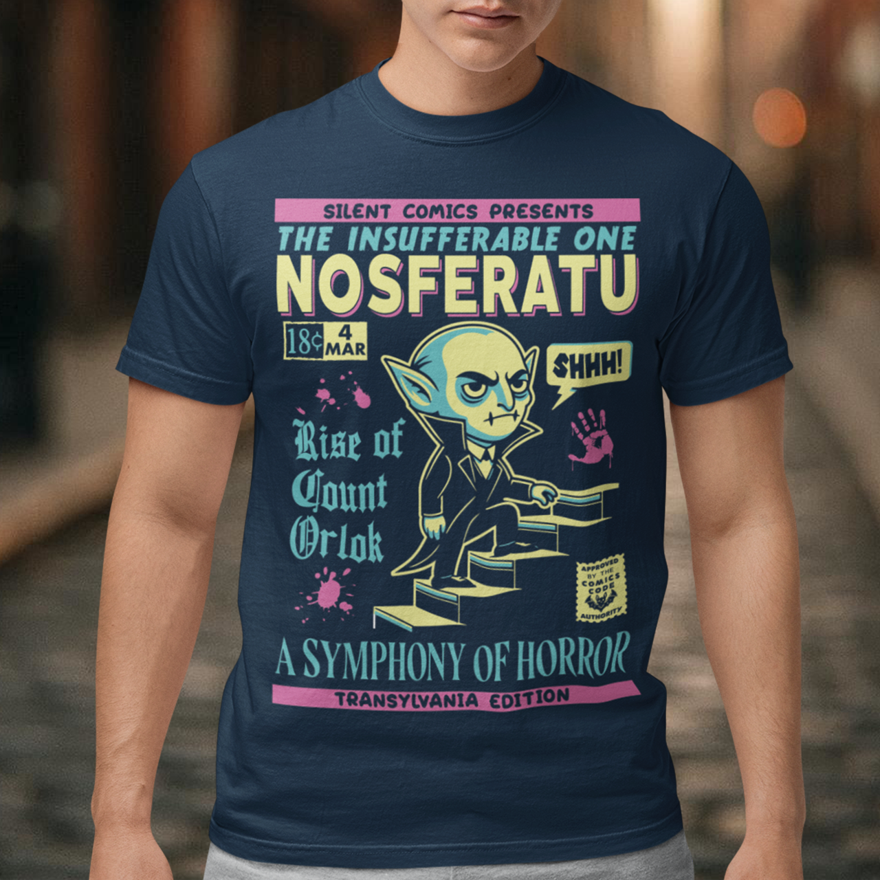 Unleash the eerie allure of classic horror with this Nosferatu comic book cover t-shirt! The design features a stunning vintage-style comic book rendition of the iconic vampire, Count Orlok, emerging from the shadows. Perfect for fans of classic horror, retro comics, and timeless gothic vibes, this t-shirt is a wearable piece of cinematic and artistic history.
