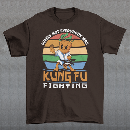 Introducing our vibrant and whimsical "Kung Fu Carrot" T-shirt, a perfect blend of humor and retro flair that's sure to turn heads! This unique design features a fearless carrot assuming a kung fu stance against the backdrop of a mesmerizing retro sun. The carrot's determined expression and martial arts pose exude confidence and playfulness. Surrounding this dynamic scene is the iconic phrase "SURELY NOT EVERYBODY WAS KUNG FU FIGHTING,".