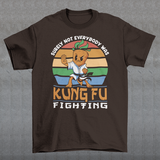 Introducing our vibrant and whimsical "Kung Fu Carrot" T-shirt, a perfect blend of humor and retro flair that's sure to turn heads! This unique design features a fearless carrot assuming a kung fu stance against the backdrop of a mesmerizing retro sun. The carrot's determined expression and martial arts pose exude confidence and playfulness. Surrounding this dynamic scene is the iconic phrase "SURELY NOT EVERYBODY WAS KUNG FU FIGHTING,".