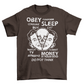 Brown t-shirt with alien emerging from a head with text "OBEY, CONFORM, CONSUME, SLEEP, WATCH TV, MONEY IS YOUR GOD".