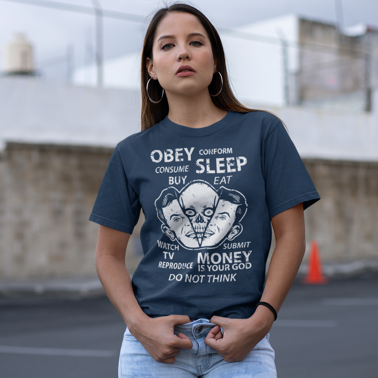 Navy t-shirt with alien emerging from a head with text "OBEY, CONFORM, CONSUME, SLEEP, WATCH TV, MONEY IS YOUR GOD".