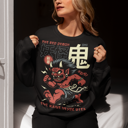 Bold, fierce, and unstoppable — this dynamic sweatshirt features a powerful Japanese Oni mid-sprint, eyes blazing and muscles tense with fury. Above the image, bold text declares "THE RED DEMON", while below, a chilling reminder reads: "THE RAGE NEVER DIES". This shirt captures the raw energy and mythic wrath of the Oni spirit — perfect for those who embrace intensity and never back down.