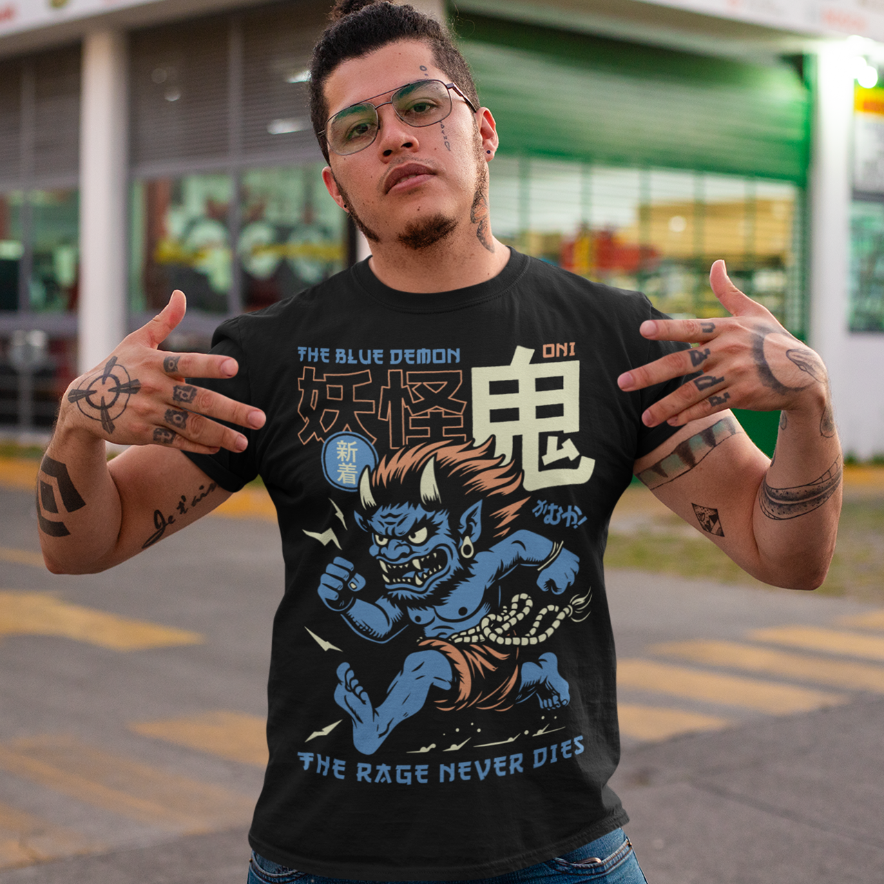 Bold, fierce, and unstoppable — this dynamic tee features a powerful Japanese Oni mid-sprint, eyes blazing and muscles tense with fury. Above the image, bold text declares "THE BLUE DEMON", while below, a chilling reminder reads: "THE RAGE NEVER DIES". This shirt captures the raw energy and mythic wrath of the Oni spirit — perfect for those who embrace intensity and never back down.