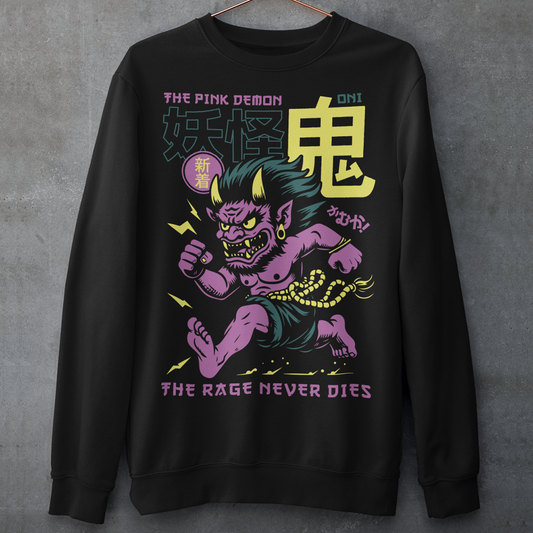 Bold, fierce, and unstoppable — this dynamic sweatshirt features a powerful Japanese Oni mid-sprint, eyes blazing and muscles tense with fury. Above the image, bold text declares "THE PINK DEMON", while below, a chilling reminder reads: "THE RAGE NEVER DIES". This shirt captures the raw energy and mythic wrath of the Oni spirit — perfect for those who embrace intensity and never back down.