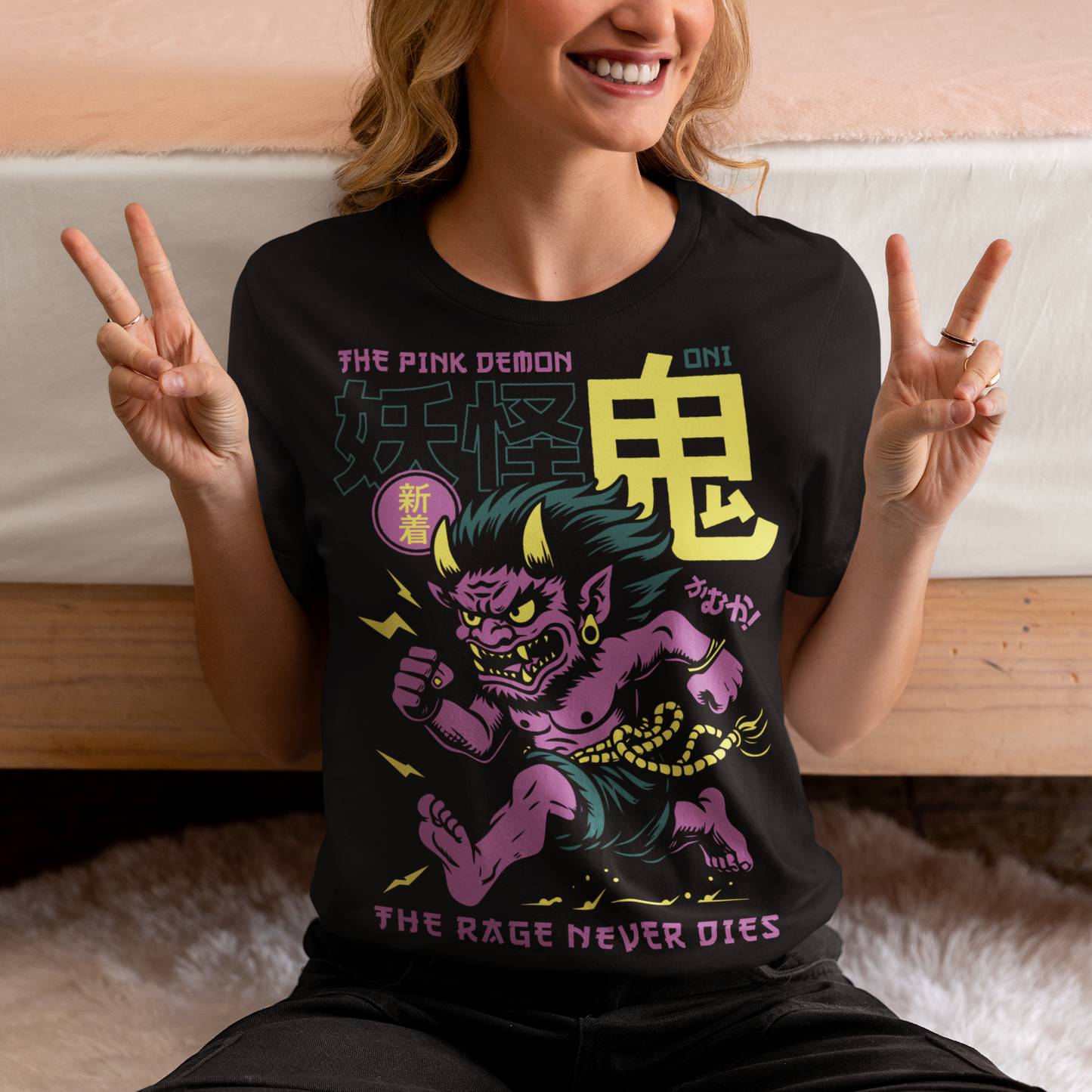 Bold, fierce, and unstoppable — this dynamic tee features a powerful Japanese Oni mid-sprint, eyes blazing and muscles tense with fury. Above the image, bold text declares "THE PINK DEMON", while below, a chilling reminder reads: "THE RAGE NEVER DIES". This shirt captures the raw energy and mythic wrath of the Oni spirit — perfect for those who embrace intensity and never back down.