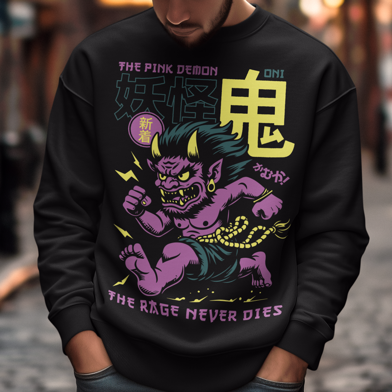 Bold, fierce, and unstoppable — this dynamic sweatshirt features a powerful Japanese Oni mid-sprint, eyes blazing and muscles tense with fury. Above the image, bold text declares "THE PINK DEMON", while below, a chilling reminder reads: "THE RAGE NEVER DIES". This shirt captures the raw energy and mythic wrath of the Oni spirit — perfect for those who embrace intensity and never back down.