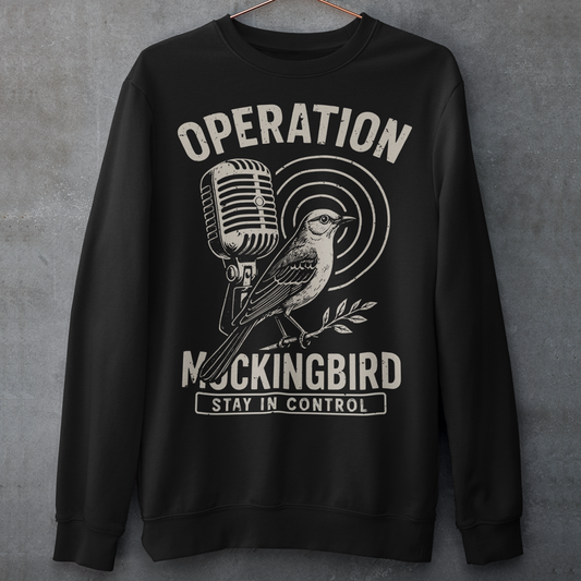 Celebrate a fascinating piece of Cold War history with this Operation Mockingbird sweatshirt. Featuring a sleek graphic of a mockingbird perched on a microphone, the design nods to the program that sought to influence news media during the mid-20th century. Perfect for history enthusiasts, political science buffs, and anyone who loves thought-provoking apparel.