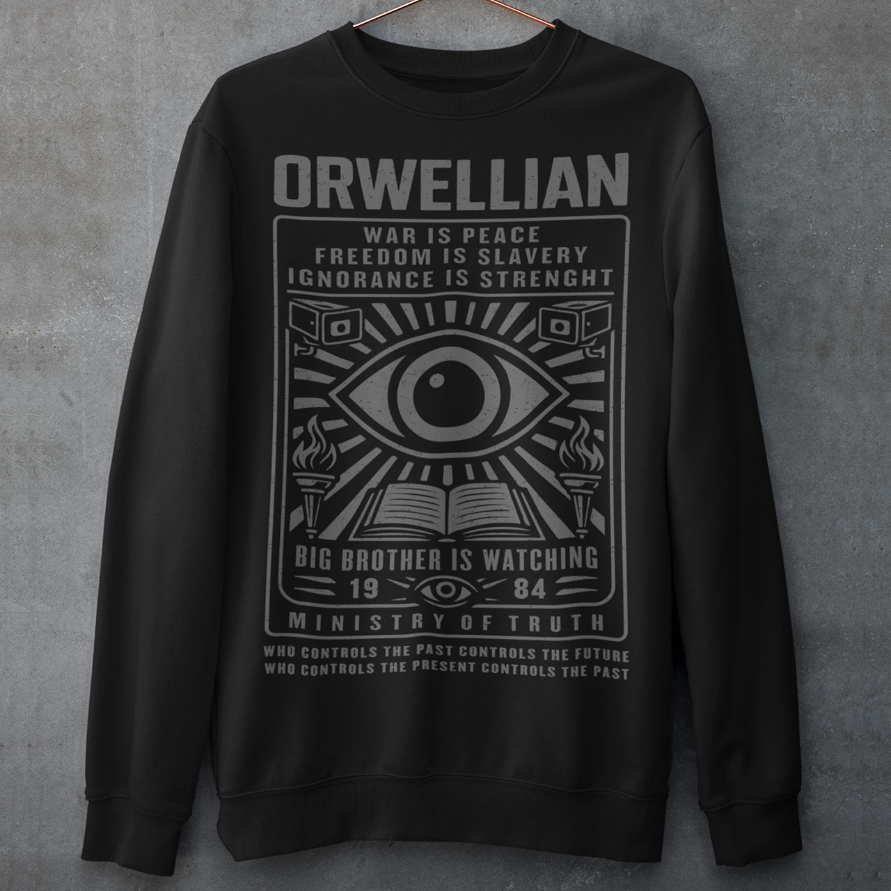 This black Sweatshirt channels the unsettling spirit of George Orwell’s 1984 with bold, high-contrast artwork and iconic slogans that refuse to whisper. The all-seeing eye dominates the design, flanked by surveillance cameras, burning torches, and an open book, a visual chorus of control, truth, and resistance. Phrases like “War Is Peace,” “Freedom Is Slavery,” and “Ignorance Is Strength” sit beneath the unmistakable warning: Big Brother Is Watching.