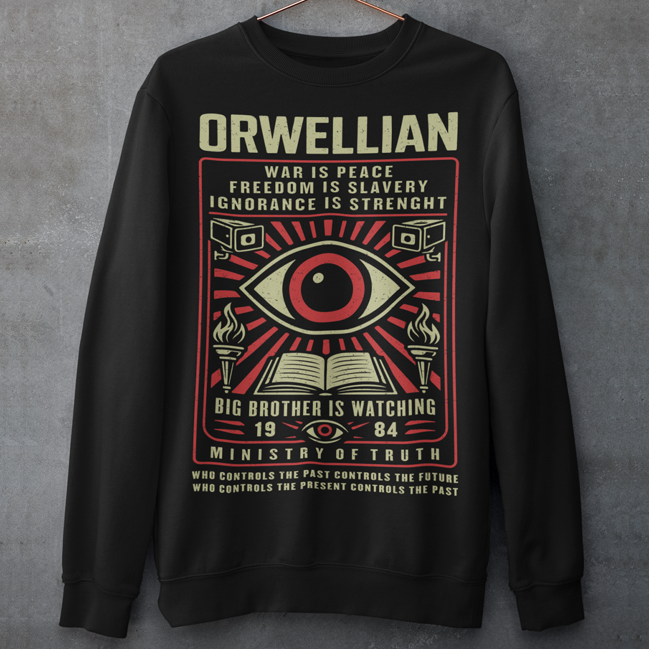 This black Sweatshirt channels the unsettling spirit of George Orwell’s 1984 with bold, high-contrast artwork and iconic slogans that refuse to whisper. The all-seeing eye dominates the design, flanked by surveillance cameras, burning torches, and an open book, a visual chorus of control, truth, and resistance. Phrases like “War Is Peace,” “Freedom Is Slavery,” and “Ignorance Is Strength” sit beneath the unmistakable warning: Big Brother Is Watching.