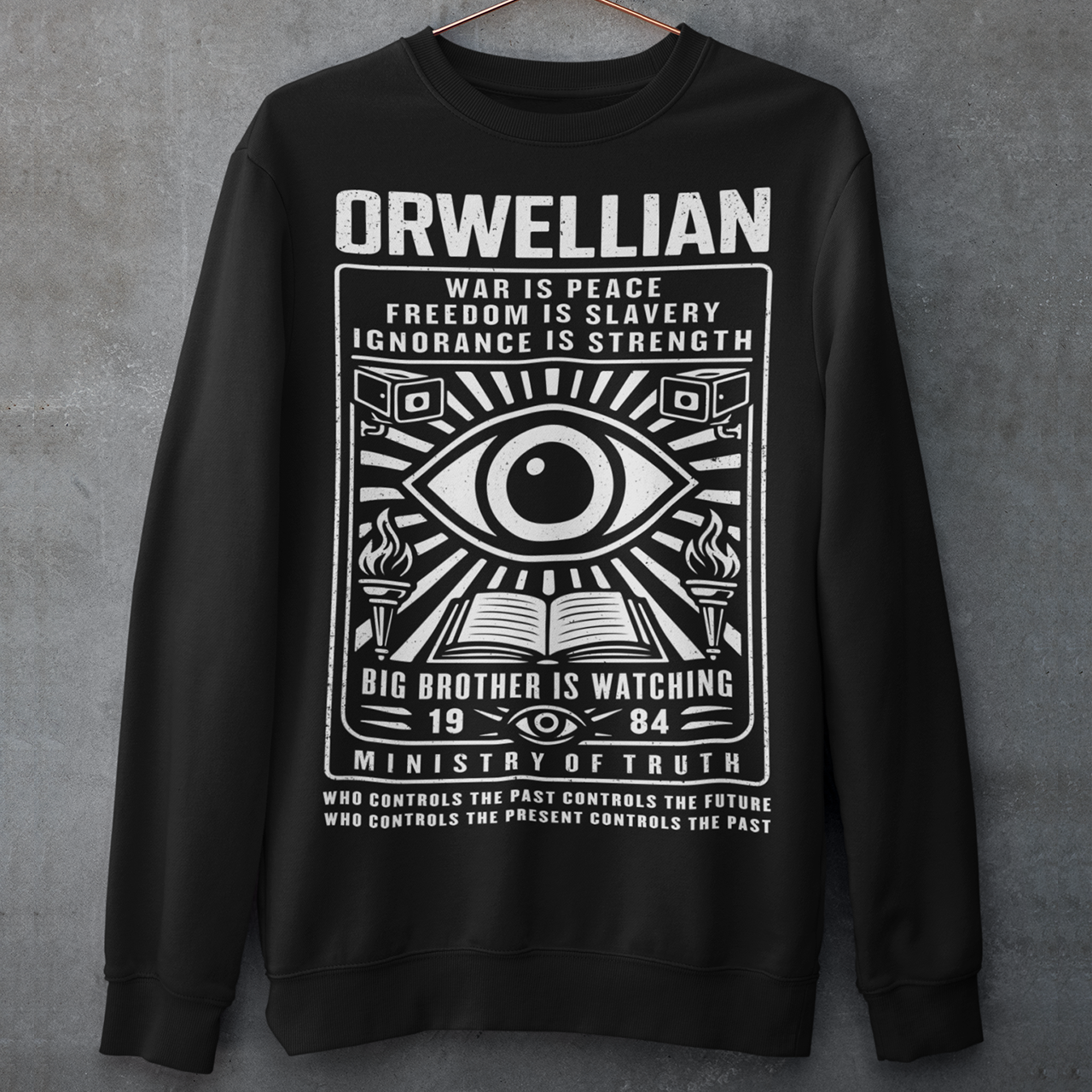 This black Sweatshirt channels the unsettling spirit of George Orwell’s 1984 with bold, high-contrast artwork and iconic slogans that refuse to whisper. The all-seeing eye dominates the design, flanked by surveillance cameras, burning torches, and an open book, a visual chorus of control, truth, and resistance. Phrases like “War Is Peace,” “Freedom Is Slavery,” and “Ignorance Is Strength” sit beneath the unmistakable warning: Big Brother Is Watching.