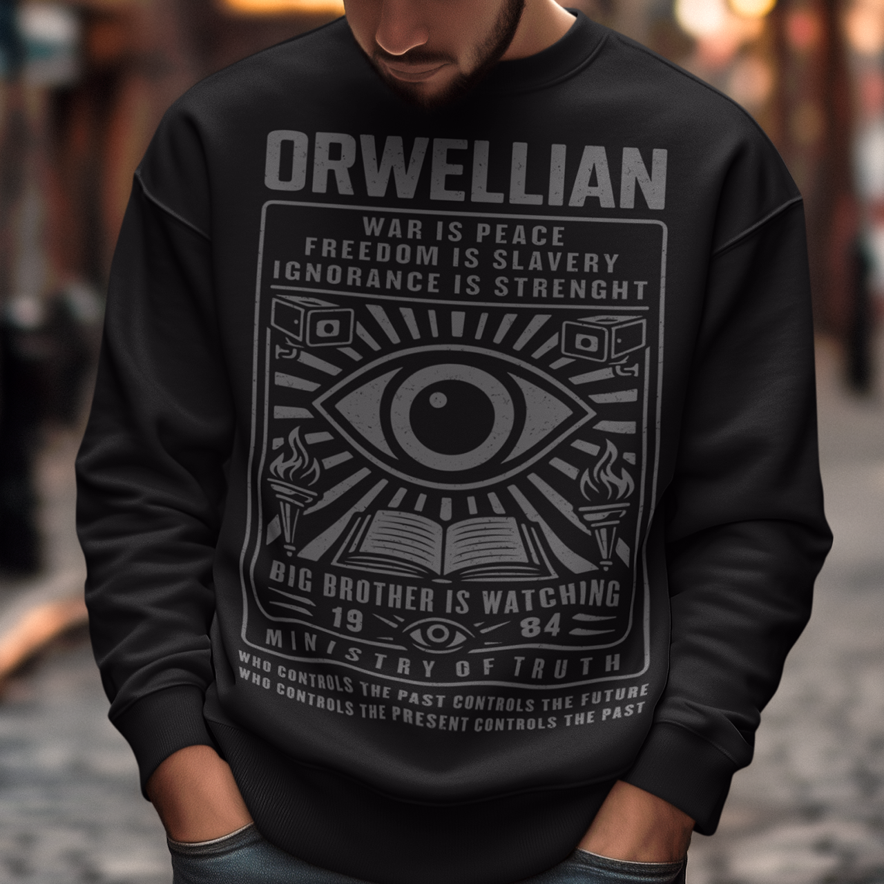 This black Sweatshirt channels the unsettling spirit of George Orwell’s 1984 with bold, high-contrast artwork and iconic slogans that refuse to whisper. The all-seeing eye dominates the design, flanked by surveillance cameras, burning torches, and an open book, a visual chorus of control, truth, and resistance. Phrases like “War Is Peace,” “Freedom Is Slavery,” and “Ignorance Is Strength” sit beneath the unmistakable warning: Big Brother Is Watching.
