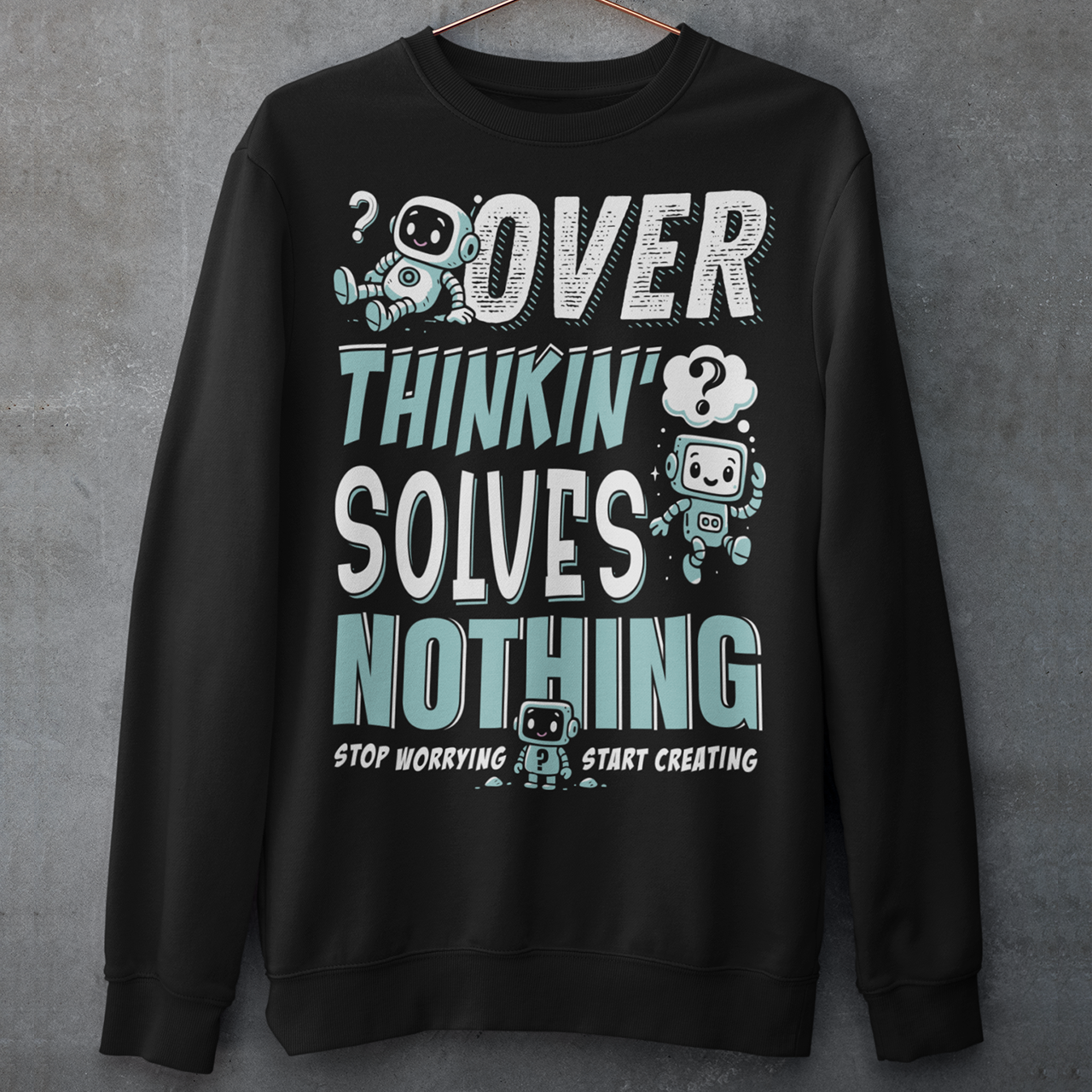Break the cycle of overthinking in style with this uplifting graphic sweatshirt featuring adorable retro robots and the bold message: “Over Thinkin’ Solves Nothing — Stop Worrying, Start Creating.” This design blends playful charm with a motivating reminder to take action instead of stressing. Perfect for artists, students, creators, or anyone who needs a boost of encouragement, this shirt makes a thoughtful gift and a daily wearable mantra.