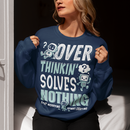 Break the cycle of overthinking in style with this uplifting graphic sweatshirt featuring adorable retro robots and the bold message: “Over Thinkin’ Solves Nothing — Stop Worrying, Start Creating.” This design blends playful charm with a motivating reminder to take action instead of stressing. Perfect for artists, students, creators, or anyone who needs a boost of encouragement, this shirt makes a thoughtful gift and a daily wearable mantra.