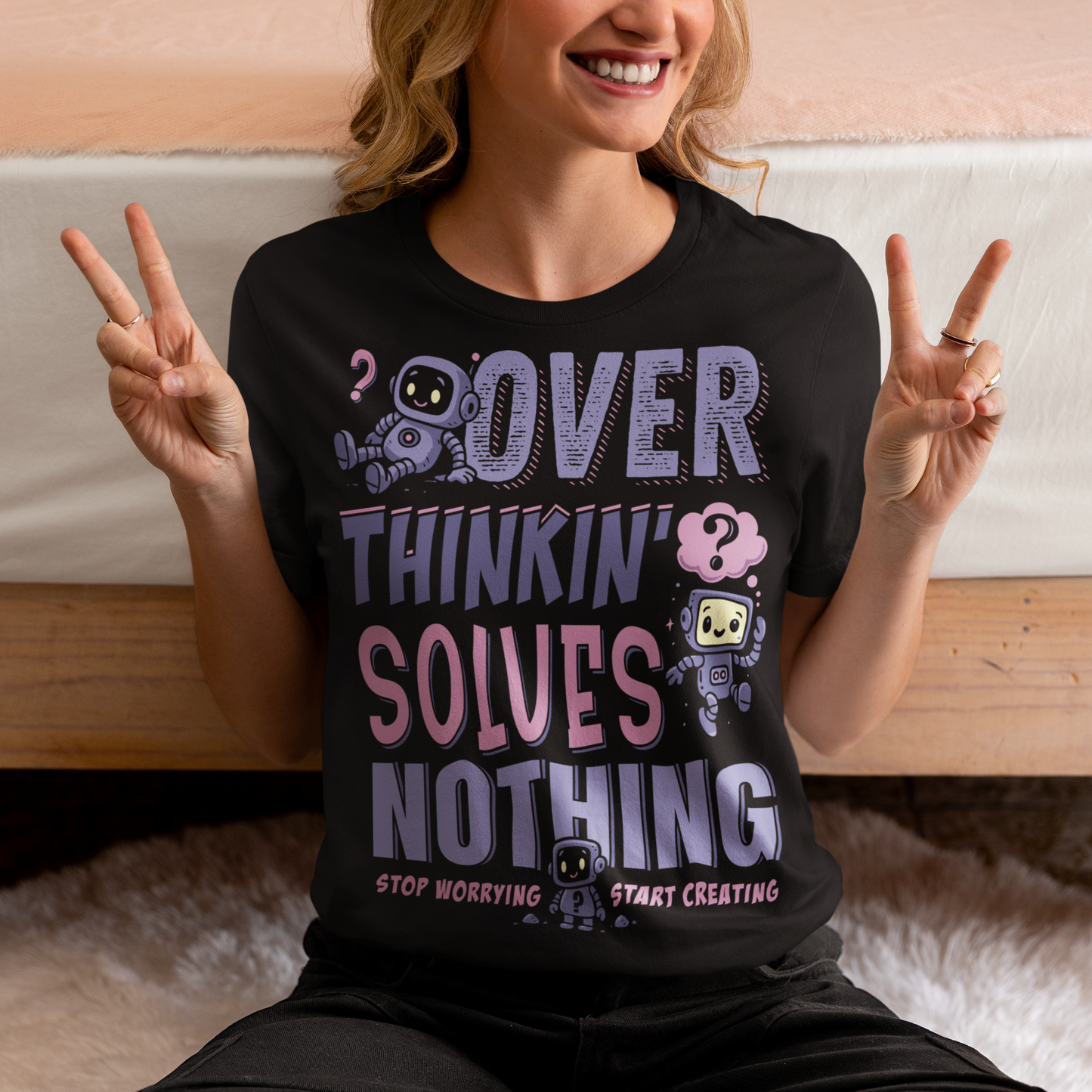Break the cycle of overthinking in style with this uplifting graphic tee featuring adorable retro robots and the bold message: “Over Thinkin’ Solves Nothing — Stop Worrying, Start Creating.” This design blends playful charm with a motivating reminder to take action instead of stressing. Perfect for artists, students, creators, or anyone who needs a boost of encouragement, this tee makes a thoughtful gift and a daily wearable mantra.