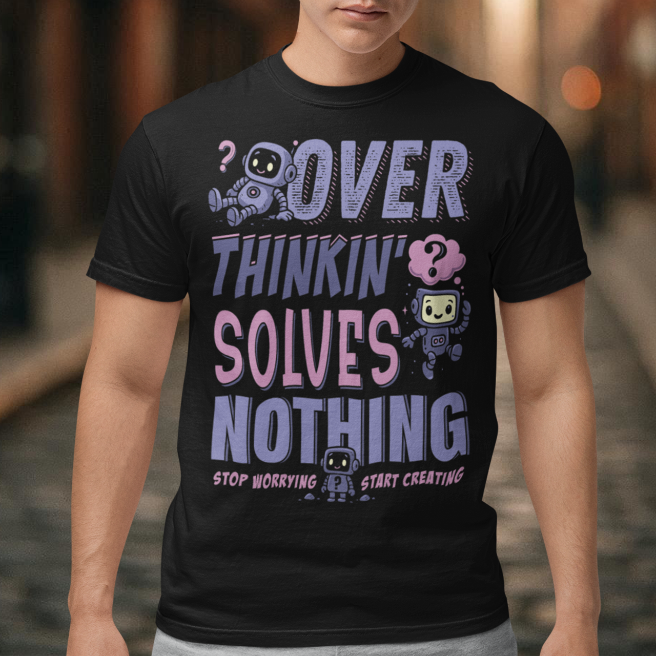 Break the cycle of overthinking in style with this uplifting graphic tee featuring adorable retro robots and the bold message: “Over Thinkin’ Solves Nothing — Stop Worrying, Start Creating.” This design blends playful charm with a motivating reminder to take action instead of stressing. Perfect for artists, students, creators, or anyone who needs a boost of encouragement, this tee makes a thoughtful gift and a daily wearable mantra.