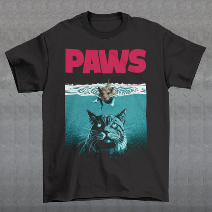 Introducing our "PAWS" T-shirt, a captivating and whimsical design that captures the perfect balance between playful and daring. This delightful shirt features an adorable little mouse fearlessly swimming on the water's surface, exuding confidence as it glides through the gentle ripples. The mouse appears relaxed and cheerful, as if it has found its true element in the aquatic world. Beneath the water, lurking stealthily, is the unmistakable silhouette of a cat.