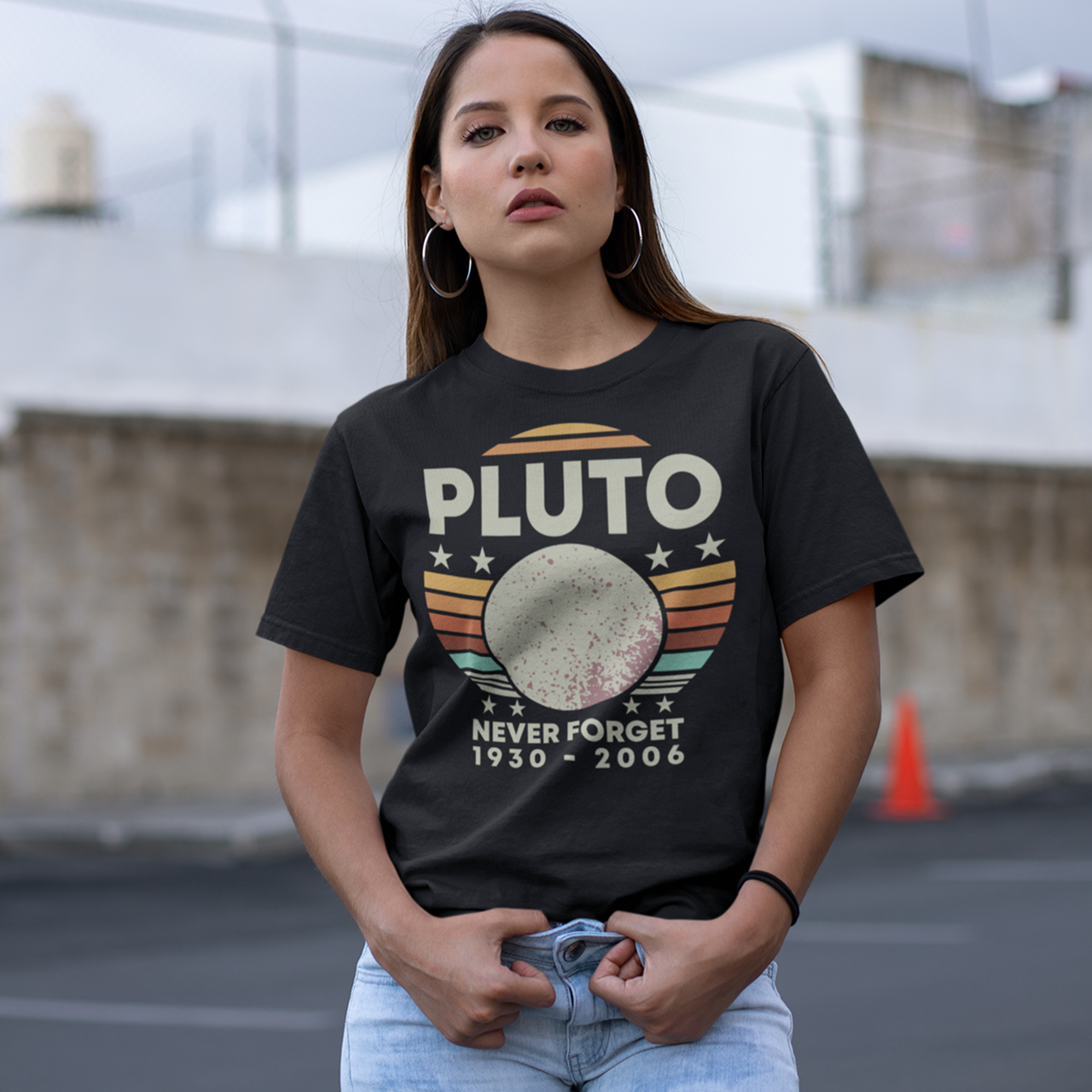 Black t-shirt of Pluto in front of a retro sun with text above PLUTO and text underneath NEVER FORGET 1930 - 2006.