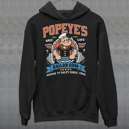 Hit the gym like a legend with the Popeye’s Sailor Gym Hoodie! Inspired by everyone’s favorite spinach-powered sailor, this shirt is perfect for lifting, lounging, or showing off your old-school strength. Featuring a vintage-style graphic of Popeye pumping iron with the slogan "Keepin' It Salty Since 1929", this tee brings serious muscle and serious nostalgia.