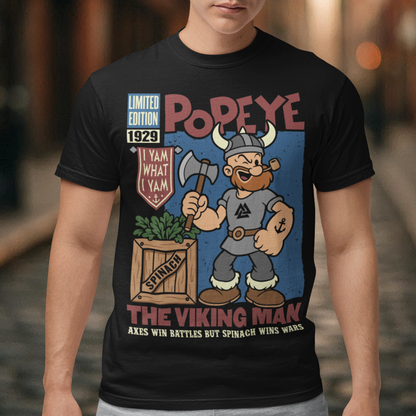 Channel old-school cartoon strength with this bold Popeye Viking graphic t-shirt, where classic sailor swagger sails north into Viking territory. This playful design features a bearded Viking version of the legendary spinach-powered sailor, proudly gripping an axe beside a crate of spinach. With retro comic styling, vintage textures, and the iconic phrase “I Yam What I Yam,” the artwork celebrates the timeless humor and toughness that made the character famous.