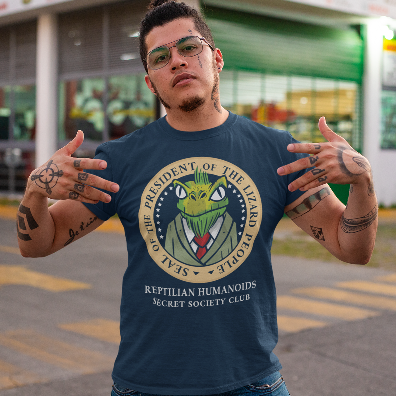 Navy t-shirt of a president of the lizard people in a presidential seal with text around SEAL OF THE PRESIDENT OF THE LIZARD PEOPLE. Text underneath REPTILIAN HUMANOIDS SECRET SOCIETY CLUB.