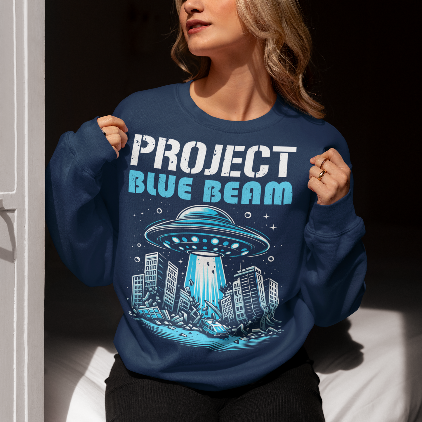 Navy sweatshirt of a UFO destroying a city and text "PROJECT BLUE BEAM."