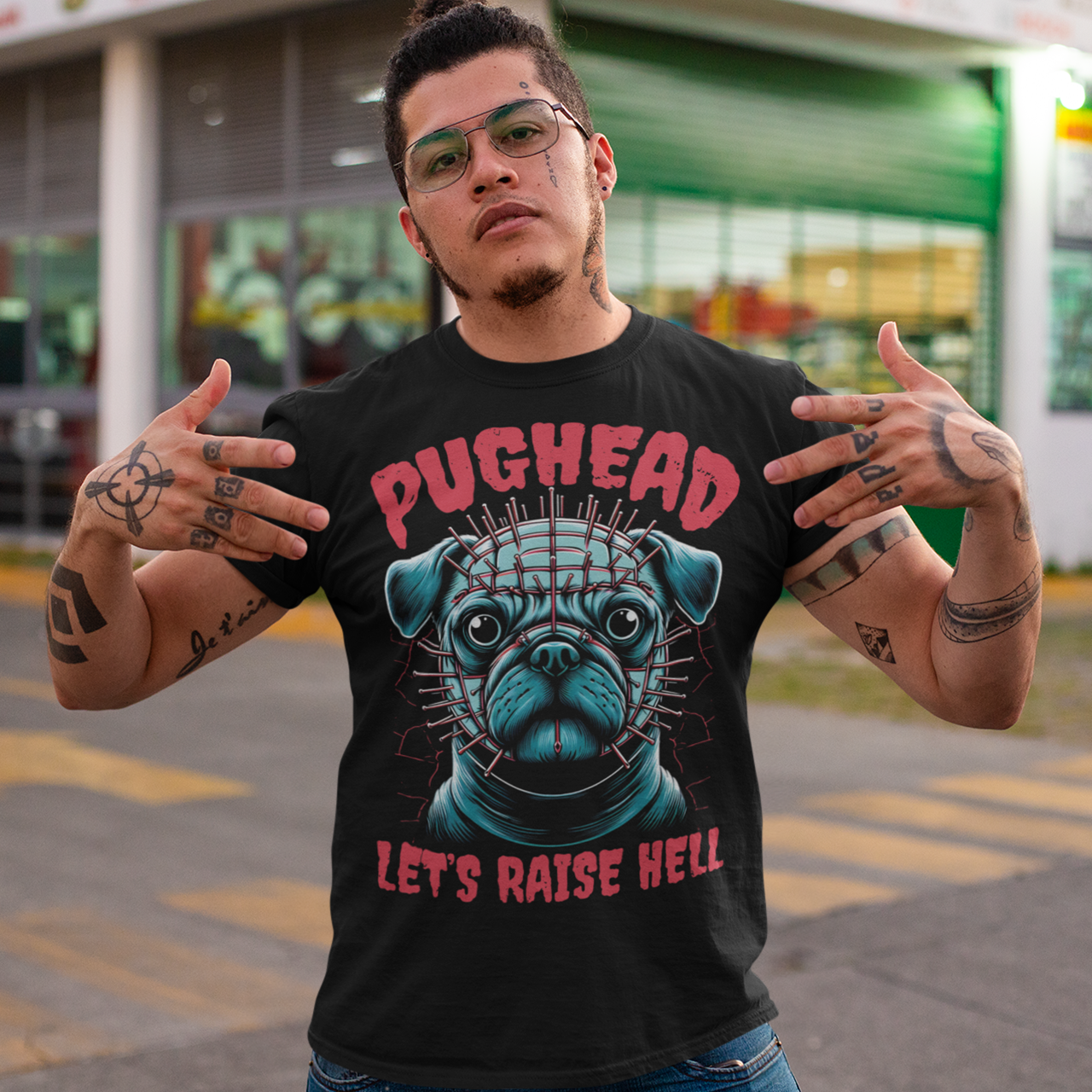 Black t-shirt of a pug with pins in his head and text "PUGHEAD LET'S RAISE HELL."