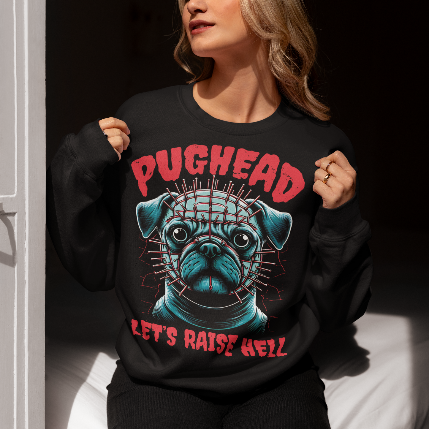 Black sweatshirt of a pug with pins in his head and text "PUGHEAD LET'S RAISE HELL."