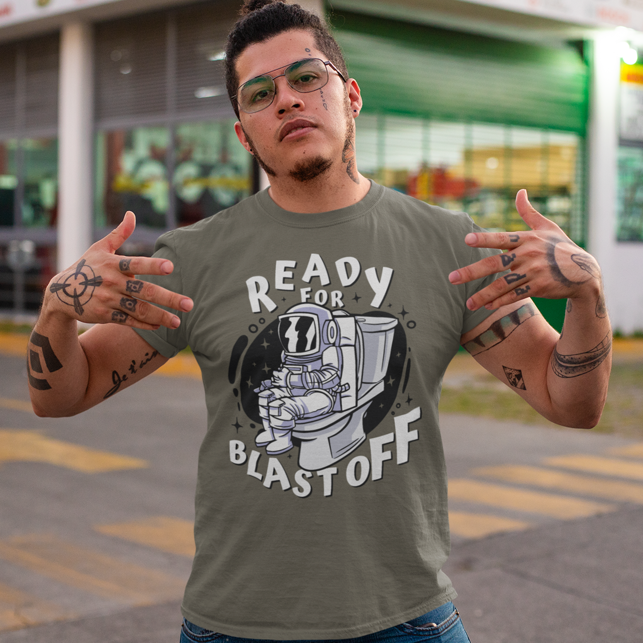 Army t-shirt of astronaut sitting on toilet with text "READY FOR BLAST OFF".