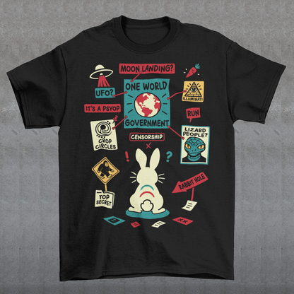 Black t-shirt featuring a humorous conspiracy theory design with a confused rabbit standing before a bulletin board connected by red strings. The artwork includes UFOs, moon landing, lizard people, crop circles, Bigfoot, Illuminati, censorship, psyops, and rabbit hole references in a colorful retro style. A funny graphic tee for fans of conspiracies, cryptids, aliens, internet memes, and mystery-themed humor.