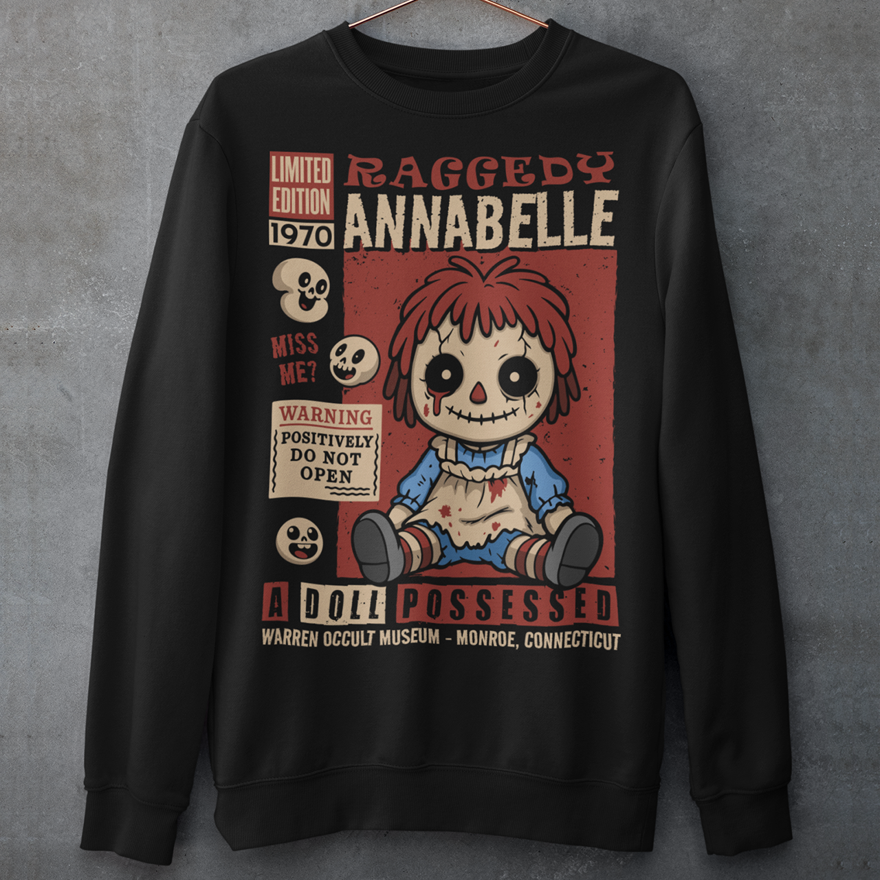 Stay cozy with a creepy-cute twist in this horror-themed sweatshirt featuring a distressed vintage doll design inspired by classic haunted-toy aesthetics. The graphic showcases a stitched, wide-eyed rag-style doll surrounded by spooky warning labels and retro horror elements, giving it the look of an old collectible poster. This shirt is ideal for horror fans, lovers of eerie artwork, and anyone who enjoys adding a little dark charm to their wardrobe.