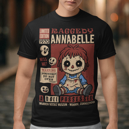 Stay cozy with a creepy-cute twist in this horror-themed t-shirt featuring a distressed vintage doll design inspired by classic haunted-toy aesthetics. The graphic showcases a stitched, wide-eyed rag-style doll surrounded by spooky warning labels and retro horror elements, giving it the look of an old collectible poster. This shirt is ideal for horror fans, lovers of eerie artwork, and anyone who enjoys adding a little dark charm to their wardrobe.