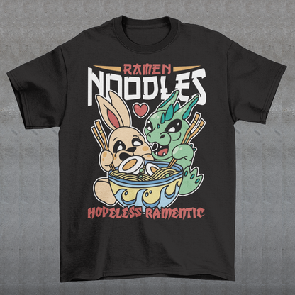Indulge in the whimsical harmony of culinary delight and fantastical companionship with our "Ramen Noodles" t-shirt featuring a captivating scene of a dragon and a rabbit sharing a bowl of savory ramen. This unique and charming design seamlessly blends the worlds of mythical creatures and culinary passion to create a wearable work of art. Above the delightful duo, the bold text proudly declares "RAMEN NOODLES," setting the stage for the central theme of this captivating tee.