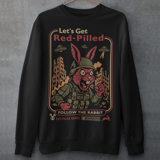 This black graphic sweatshirt dives headfirst down the rabbit hole. Featuring a fierce, red-eyed rabbit geared up like a rebel soldier, the design blends sci-fi paranoia, retro poster aesthetics, and counterculture attitude. Bold lettering reads “Let’s Get Red-Pilled” with “Follow the Rabbit” anchoring the scene, while crumbling cityscapes and hovering UFOs set a dystopian, mind-bending mood. This shirt feels like a lost propaganda poster from an alternate reality.