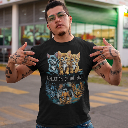 The design on this t-shirt is a captivating depiction of three cats, each gazing at their reflection in the water. Positioned in front of them are the majestic figures of a lion, a panther, and a tiger, their images rippling in the tranquil surface. The cats appear transfixed, their eyes filled with curiosity and introspection as they peer into the depths. In the center of the design, bold text reads "REFLECTION OF THE SOUL," drawing attention to the profound theme of self-awareness and inner contemplation