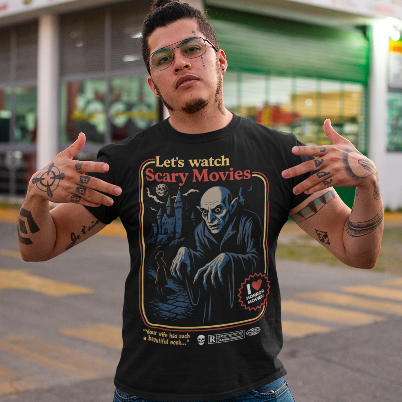 Stay warm with a touch of vintage terror in this Nosferatu-inspired horror shirt. Designed in a retro poster style, it features a classic vampire creeping through a moonlit scene, complete with bold colors, distressed detailing, and nostalgic typography that captures the eerie charm of early silent-film monsters. This shirt is a must-have for horror lovers, gothic aesthetics fans, and anyone who appreciates timeless spooky cinema.